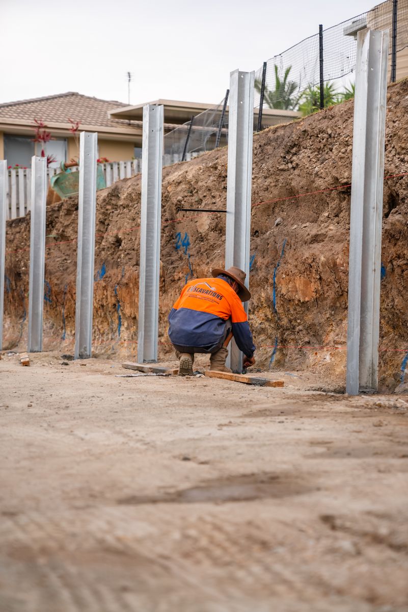 Steel posts set for retaining wall