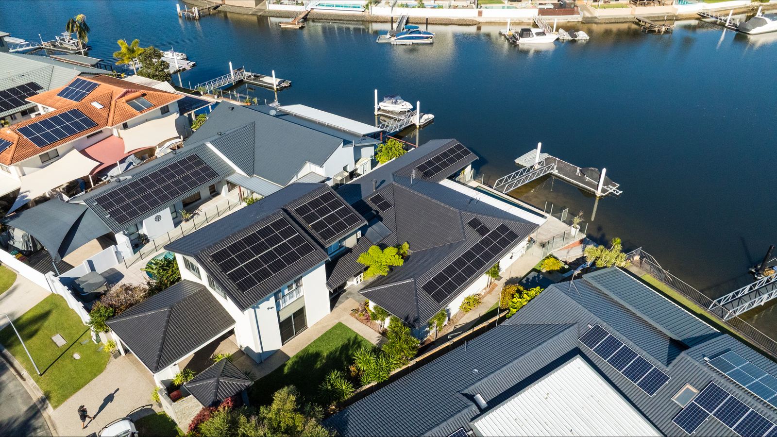 Aerial view of solar installation on a Gold Coast waterfront home