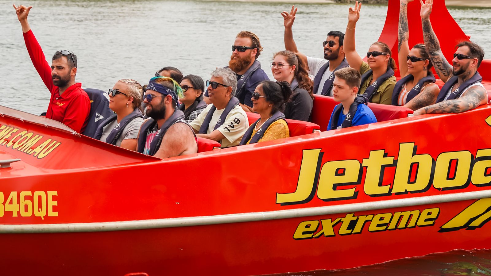 Passengers aboard a Jetboat Extreme ride on the Broadwater